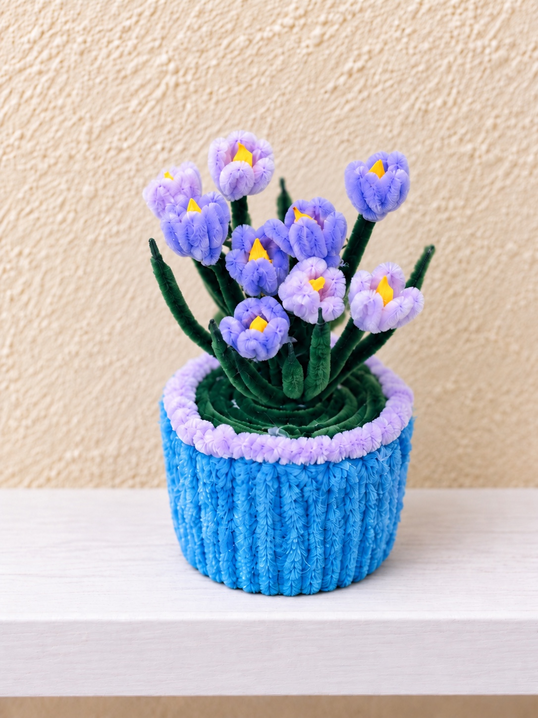 Lavender blooms in a blue pot — handcrafted flower arrangement