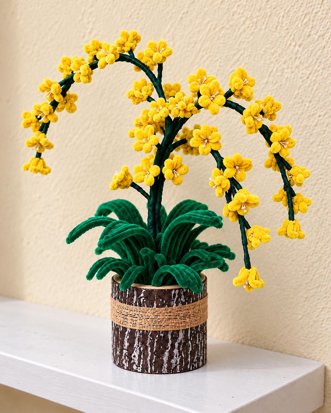 Yellow handcrafted blossom arrangement with arching branches and green leaves in a rustic brown pot